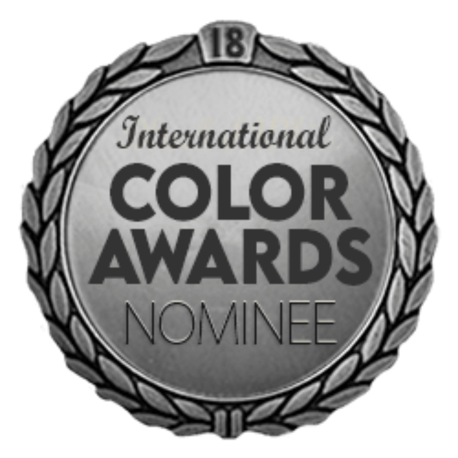 A silver award medal with laurel leaves and the text 'International Color Awards Nominee' prominently displayed.